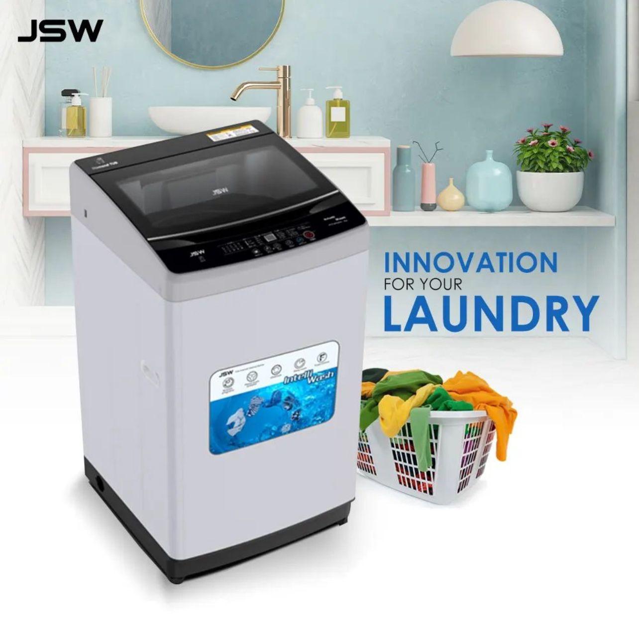 JSW washing machine in a stylish bathroom with a laundry basket and decor items.