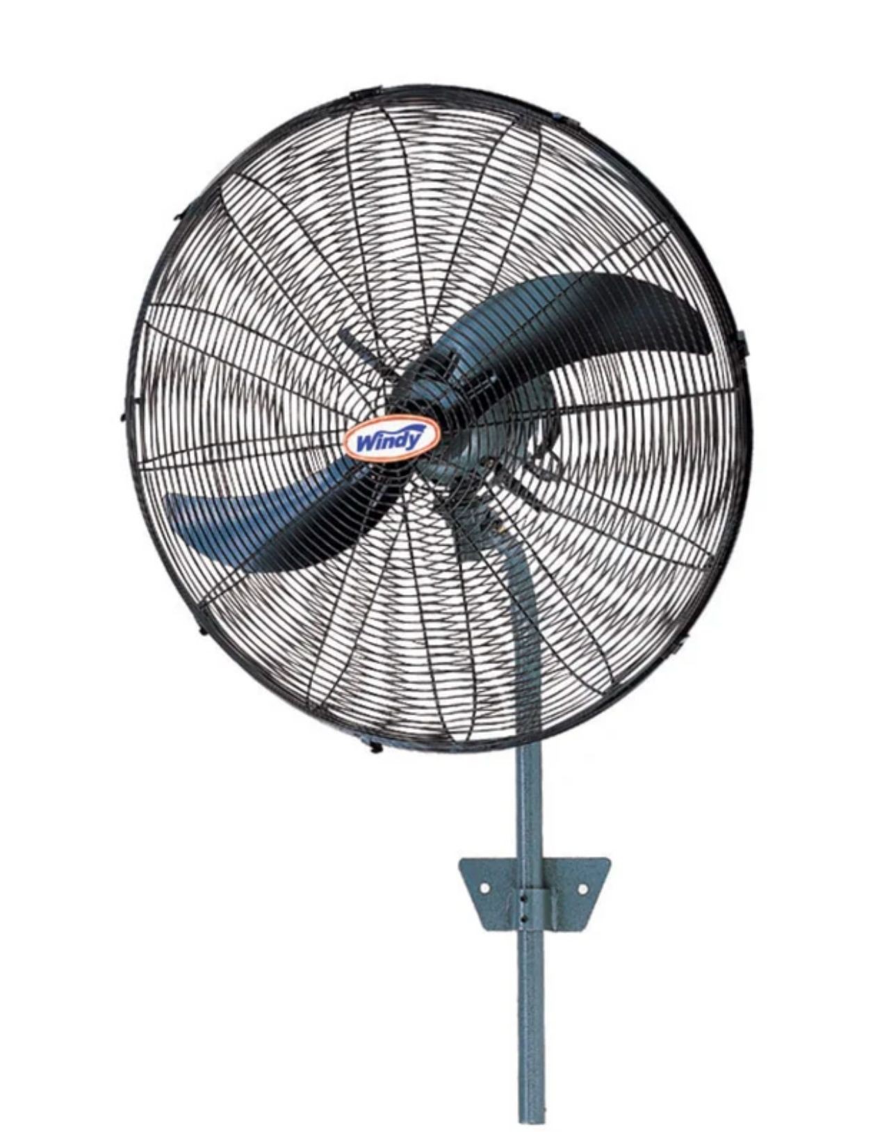 Large wall-mounted industrial fan with protective metal grille and three blades.
